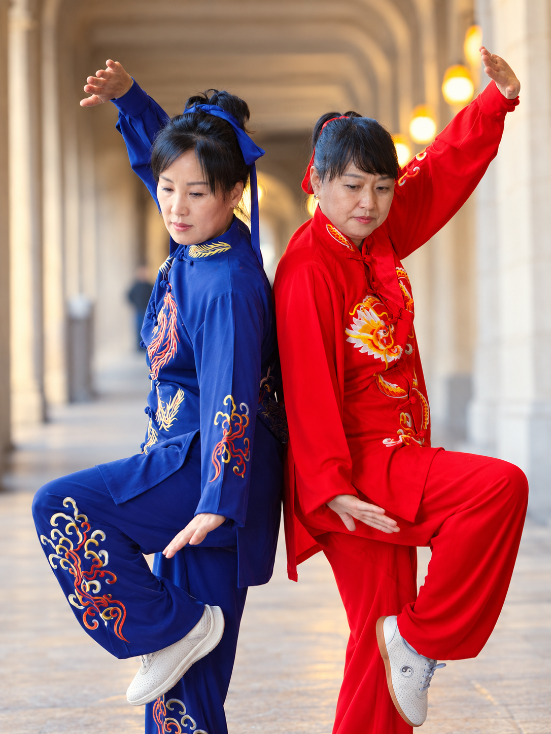 Jin Hee Muren in blue and Hee Jeong Han in red practicing Tai Chi together